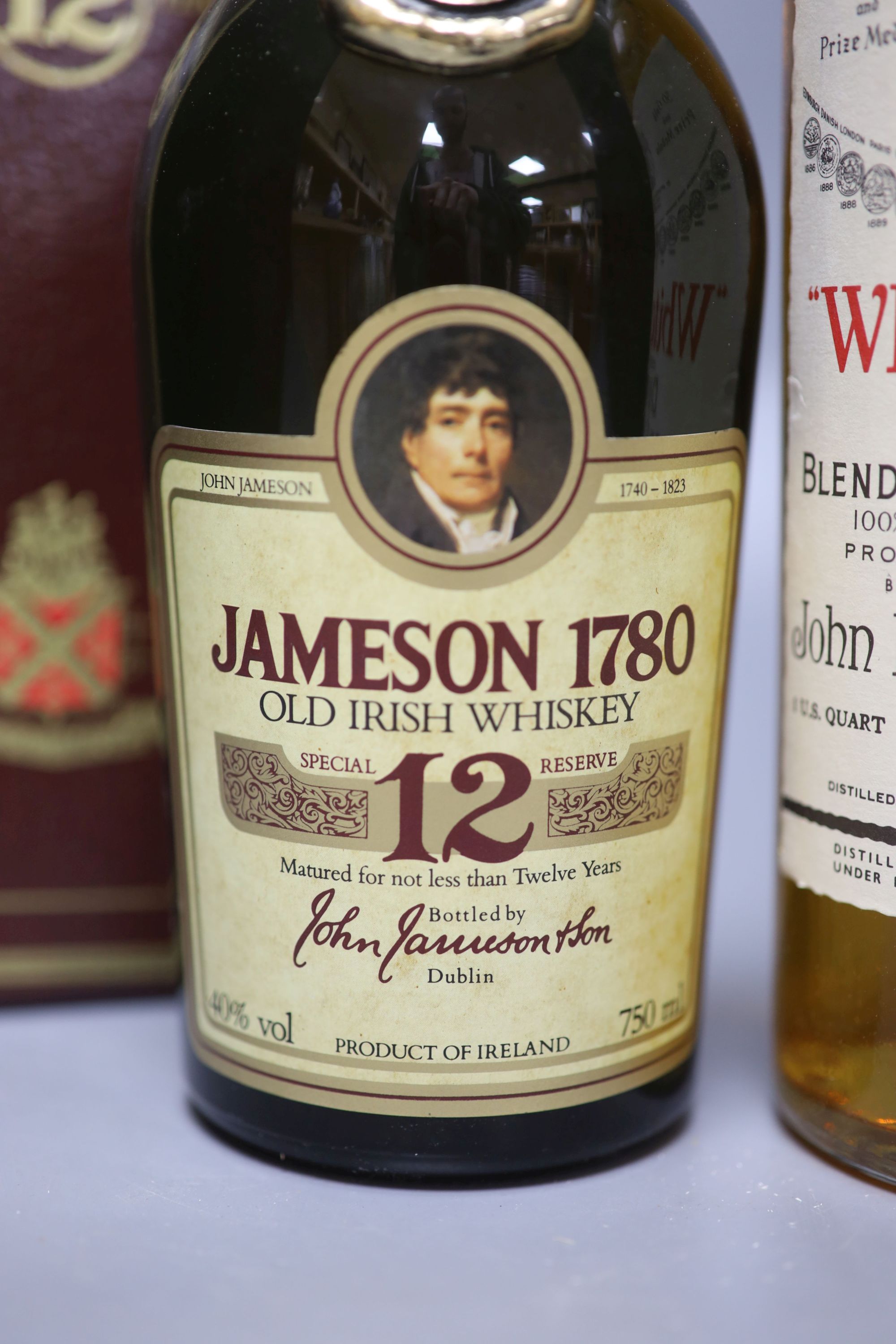 A bottle of Jamieson 1780 Old Irish Whiskey, aged 12 years, together with White Label Dewars Scotch Whisky